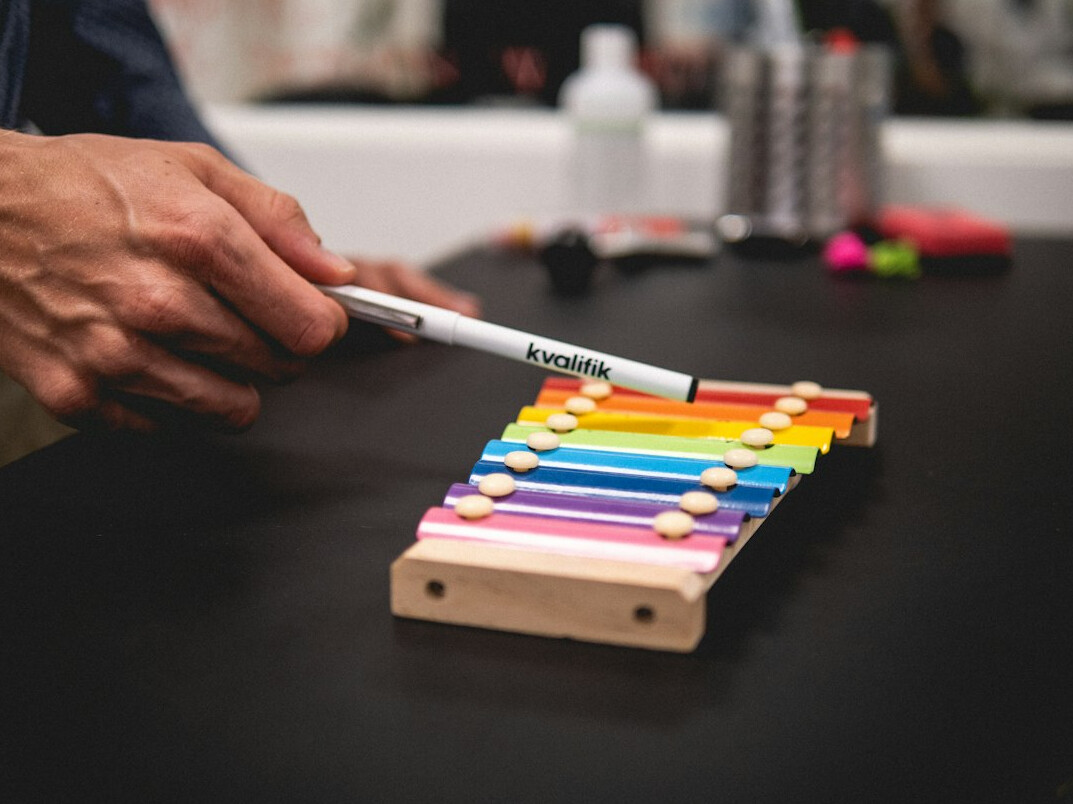 Team planning a workflow diagram on a whiteboard