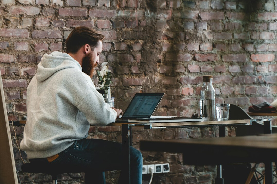 programmer working remotely on laptop