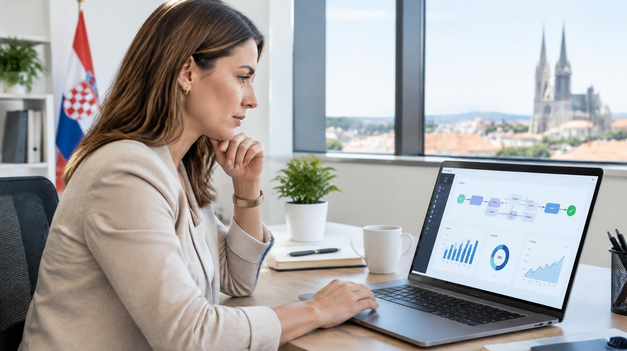 Professional reviewing a business dashboard on a laptop screen
